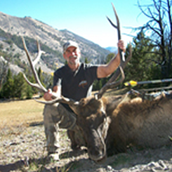 Man Posing with Elk