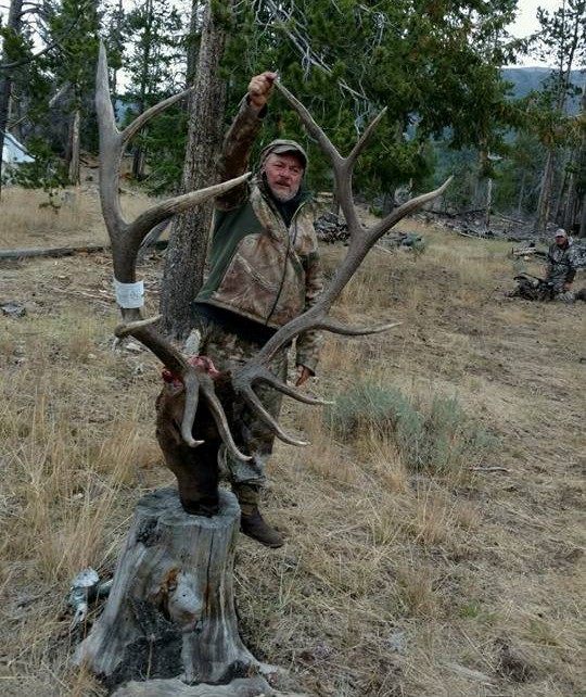 Man Posing with Deer Antlers